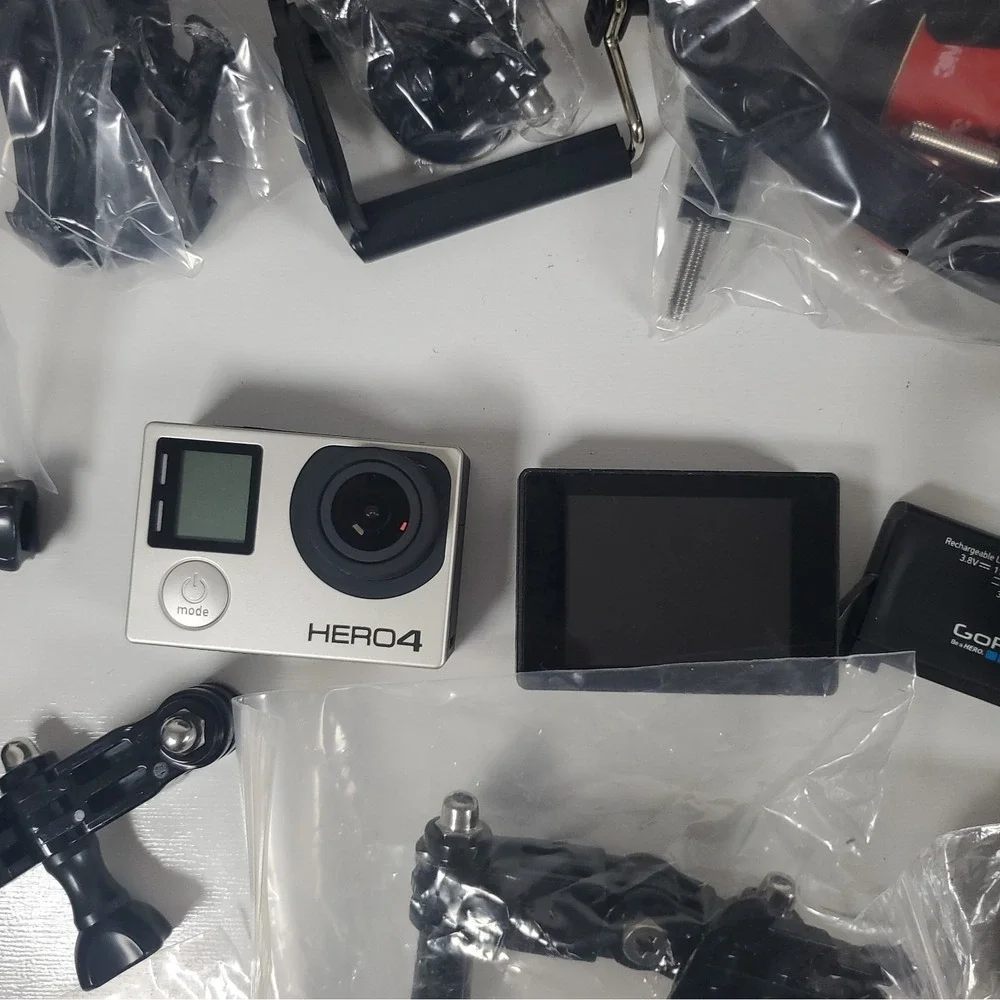GoPro Hero4, Two Batteries, And Accessories Lot. Mounts, Body And Head Harness